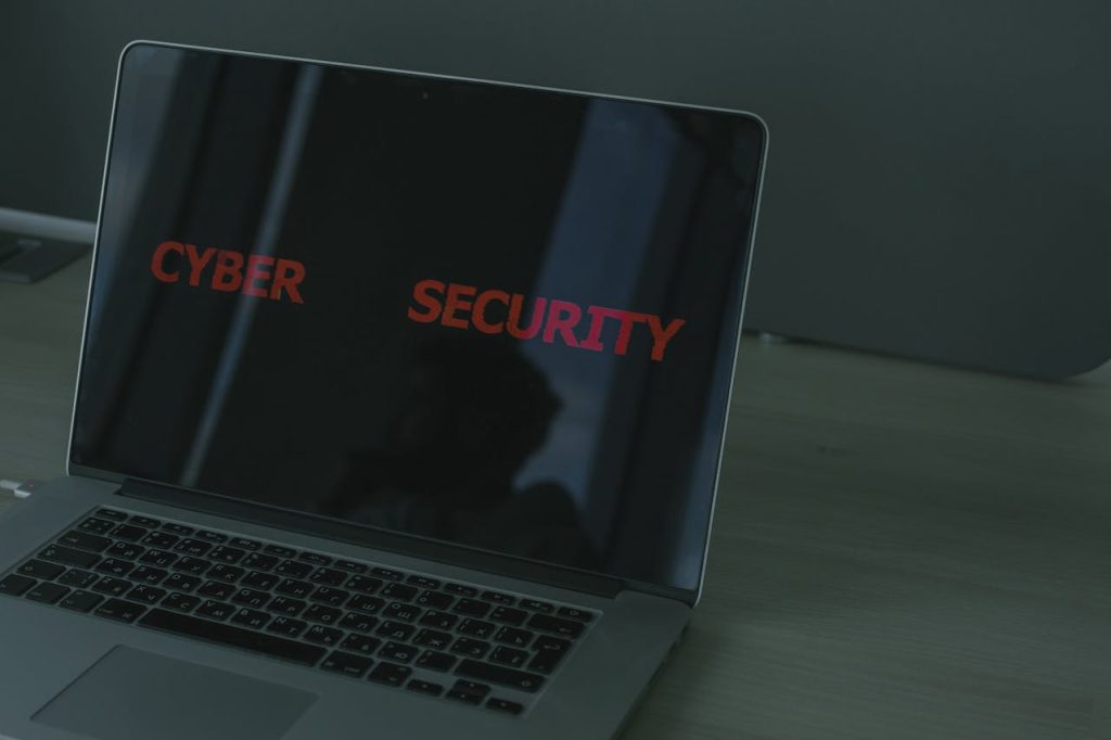 laptop-in-close-up-shot-5483248 Close-up of a laptop displaying cybersecurity text, emphasizing digital security themes.